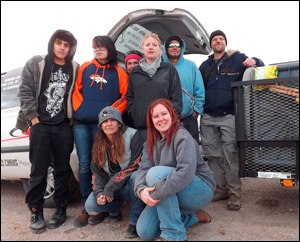 Volunteers of NMDOG are pictured in front, from left, Angela Stell, president of the nonprofit animal welfare organization, and community outreach team members, Tamra Miller; in back, from left, Nathan Baca, Angel Romero, Tina Holguin, Jenn Toennies, DJ Ward and Steve Allen.